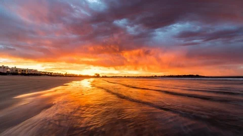 Hyperlapse of Beach with Incredible Orange and Red Sunset Stock Footage 87386924