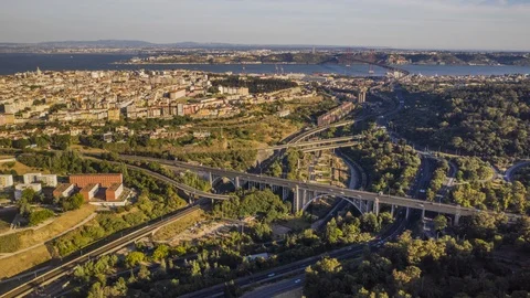 Hyperlapse of Big road interchange near Lisbon bridge, Portugal, 4k aerial drone Stock Footage 111686524
