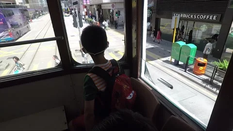 Hyperlapse, Boy Looks Through Window Inside Tram, Road Traffic, Hong Kong Stock Footage 259728795