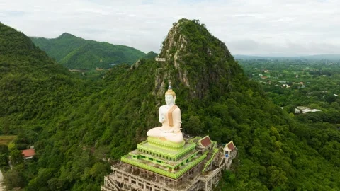 Hyperlapse Captures Big Buddha Statue Amidst Lush Green Mountains Creating .. Stock Footage 316944596