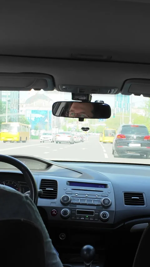 Hyperlapse of a car driving through the city from back seat. Vertical Video Stock Footage 314062038