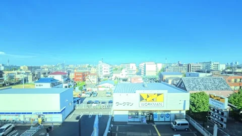 A hyperlapse of cityscape by side view of a moving urban monorail in Tokyo Stock Footage 331791392