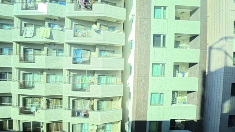 A hyperlapse of cityscape by side view of a moving urban monorail in Tokyo Stock Footage 331791408