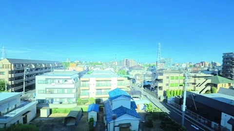 A hyperlapse of cityscape by side view of a moving urban monorail in Tokyo Stock Footage 331791409