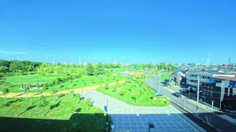 A hyperlapse of cityscape by side view of a moving urban monorail in Tokyo Stock Footage 331791414