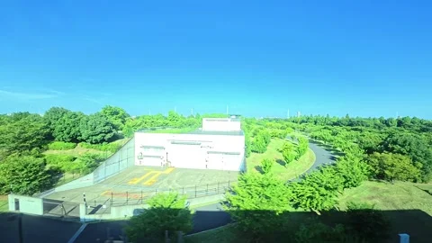 A hyperlapse of cityscape by side view of a moving urban monorail in Tokyo Stock Footage 331791420
