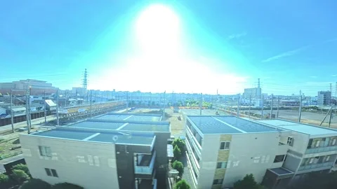 A hyperlapse of cityscape by side view of a moving urban monorail in Tokyo Stock Footage 331791437