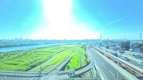 A hyperlapse of cityscape by side view of a moving urban monorail in Tokyo Stock Footage 331791450