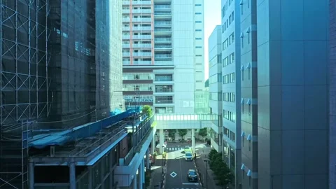 A hyperlapse of cityscape by side view of a moving urban monorail in Tokyo Stock Footage 331791453