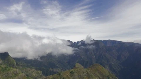 Hyperlapse of clouds from "Encumeada" to the mountains of "Pico do Areeiro" Stock Footage 119769942