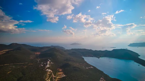 Hyperlapse clouds glide majestically above mountainous turckie terrain and water Stock Footage 267719483