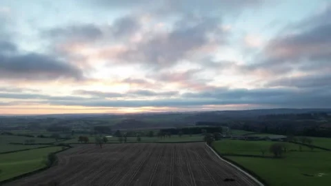 Hyperlapse Clouds moving above field at sunset - Rippon - Yorkshire - Winter Video stock 229408963