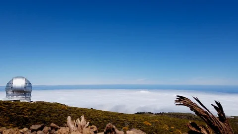 Hyperlapse of clouds moving an a big telescope at highest peak of La Palma Stock Footage 126789822