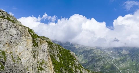 Hyperlapse of clouds moving over mountains at Susten Pass, Switzerland. Aerial 스톡 동영상 331029872