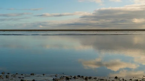 Hyperlapse of Clouds Moving Over a Reflective Lake Stock Footage 126199167