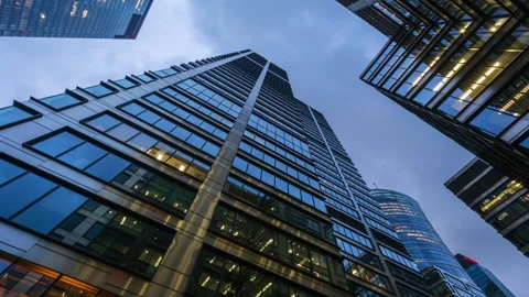 Hyperlapse day to night transition modern downtown skyscrapers looking up view Stock Footage 318906998
