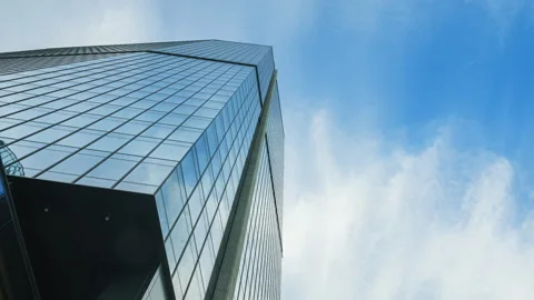Hyperlapse downtown high-rise skyscraper on sunny day, blue sky and white clouds Stock Footage 317173104