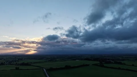 Hyperlapse of Dramatic Clouds Over Green Countryside 動画素材 345209264