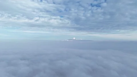 Hyperlapse of Dramatic Dark Clouds Above Dense Fog Stock Footage 343768170