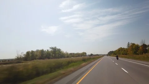 Hyperlapse Driving Behind a Motorcycle Through Countryside North of Montreal Stock Footage 121317087