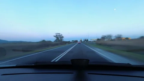Hyperlapse Driving a car at dusk with blur effect and stripes of light  Stock Footage 98568394