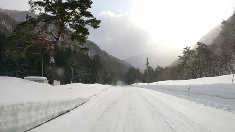 Hyperlapse driving through snow-covered roads of Japan Stock Footage 259538561