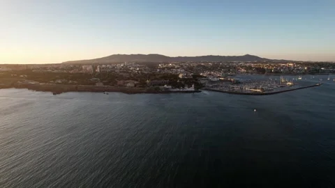 Hyperlapse drone aerial view of Cascais Bay, Portugal approaching the lighthouse Stock Footage 247444397