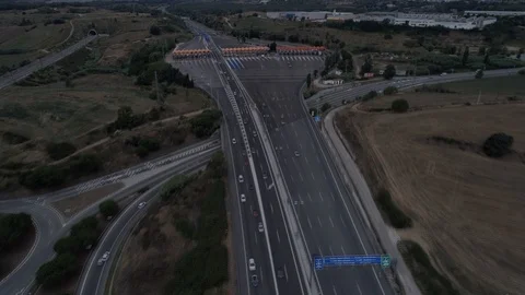 Hyperlapse of drone flight over toll with orange booths in highway Stock Footage 94833485
