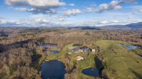 Hyperlapse drone flyover ponds and forest, cloud shadows Vosges region Stock Footage 126293156