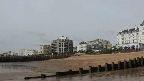 Hyperlapse of Eastbourne Seafront Hotels Viewed from the Beach at low tide Stock Footage 147683443