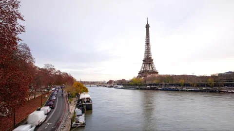 Hyperlapse of Eiffel Tower in Paris on the river Seine in winter with traffic Stock Footage 328573813