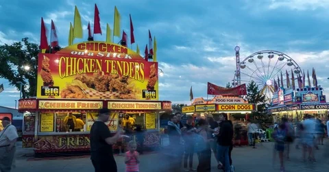 Hyperlapse of food stands and Ferris wheel at carnival Stock Footage