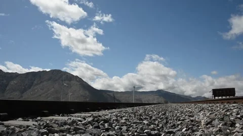 Hyperlapse footage of a windmill with clouds moving over mountains Stock Footage 151922443