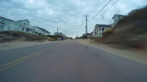 Hyperlapse of Golf Cart Driving Through Oceanfront Community Stock-Footage 74516132