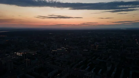 Hyperlapse at high altitude. Sunset in the evening city. Silhouettes of Stock Footage 201363145