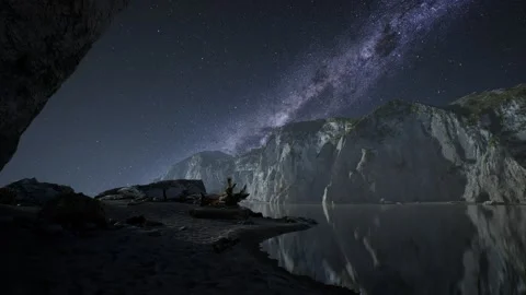 Hyperlapse of night starry sky with mountain and ocean beach in Lofoten Norway Stock Footage 143292401
