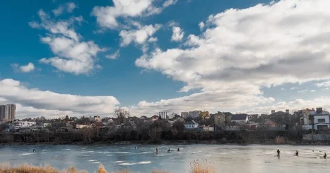 Hyperlapse over lake with winter fishers in 4K Stock Footage 124583751