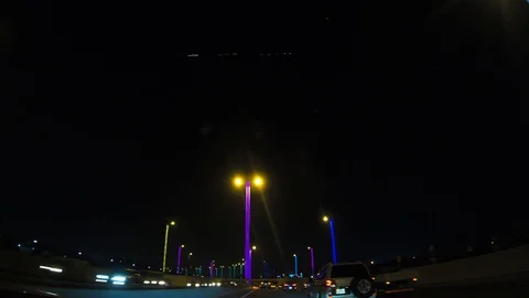 Hyperlapse over Qatar highway with different color lampposts Stock Footage 119783936