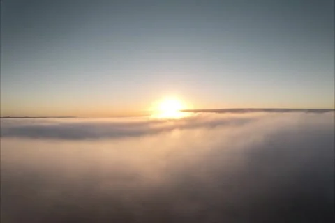 Hyperlapse over a sea of ​​clouds during a sunrise Stock Footage 244970610