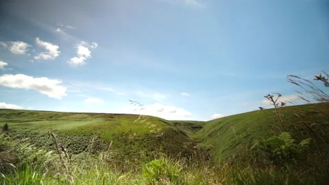 Hyperlapse overlooking green hills, clouds moving Stock Footage 277229582