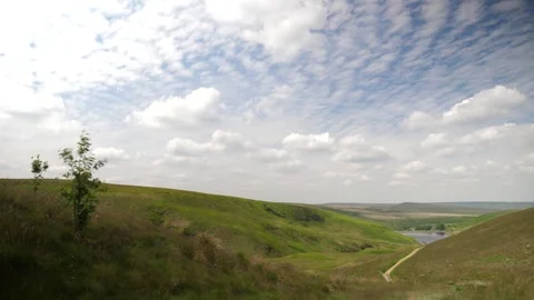 Hyperlapse overlooking green land, moving clouds Stock Footage 277229551