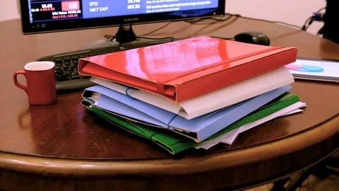 Hyperlapse of paper files that accumulate and grow on the desk Video stock 86257969