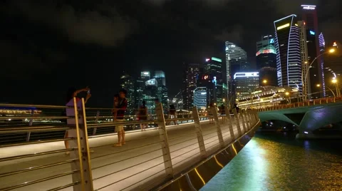 Hyperlapse of People Walking on Jubilee Bridge at Night, Marina Bay Singapore Stock Footage 51634022