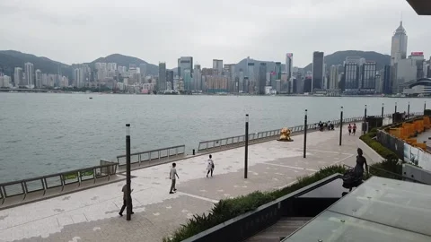 Hyperlapse of people walking in Tsim Sha Tsui water front at sunny day Video stock 142335830