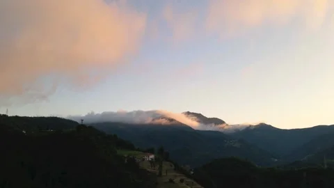 Hyperlapse with red clouds at sunset over the mountains Video stock 138605694