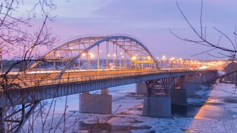 HYPERLAPSE: Road traffic on a bridge over a frozen river. Winter landscape Stock-Footage 84276136