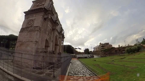 Hyperlapse Rome, Arch of Constantine and Colosseum rainy sunset, orbit 360 view Stock Footage 106432679