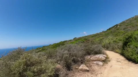 Hyperlapse-Seaside 4K walking path Giglio Island to Capel Rosso go back Stock Footage 244596047
