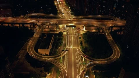 A hyperlapse shows busy traffic moving along roads and overpasses at a major Stock-Footage 314550176