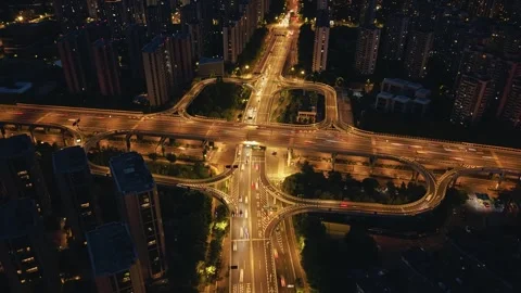 A hyperlapse shows busy traffic moving along roads and overpasses at a major Stock-Footage 314550235